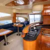 Salon with navy leather sofas and galley on the My Toy yacht