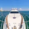 Bow of the My Toy yacht facing the Cartagena skyline