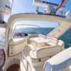 Flybridge with helm, sun lounge and table on the My Toy yacht