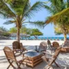 Palm trees and beach chairs at Rosario de Mar