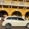 Side view of the white SUV under colonial arcades in Cartagena