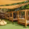 Shaded lounge beds at Mantas Beach Club