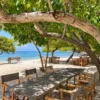 Shaded outdoor dining area at Sabai Beach Club