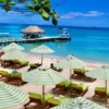 Striped umbrellas and pier at Mantas Beach Club, Rosario Islands