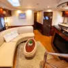 Air-conditioned salon with sofa and galley on the Suerte yacht