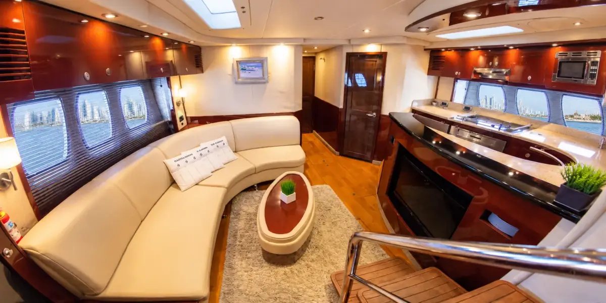 Air-conditioned salon with sofa and galley on the Suerte yacht