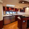 Full galley with fridge and stove on the Suerte yacht