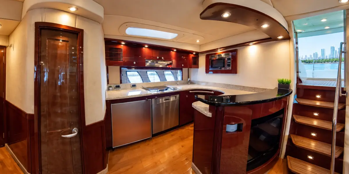 Full galley with fridge and stove on the Suerte yacht