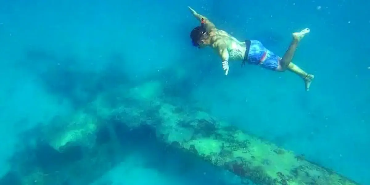 Snorkeling over the sunken plane in the Rosario Islands