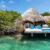 Thatched cabana on a pier over the sea at Coralina Island