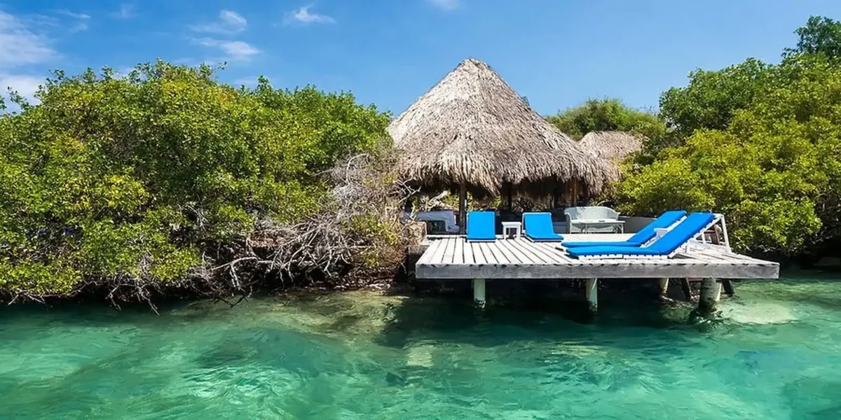 Thatched cabana on a pier over the sea at Coralina Island