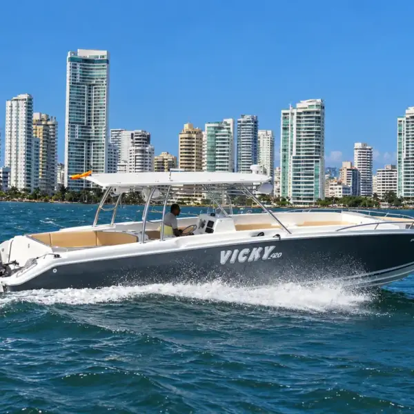 Vicky 420 42 ft private boat cruising past the Bocagrande skyline, Cartagena