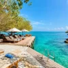 Wooden deck over turquoise water at Coralina Island