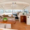 Cockpit lounge with dining table and helm on the Zetta yacht