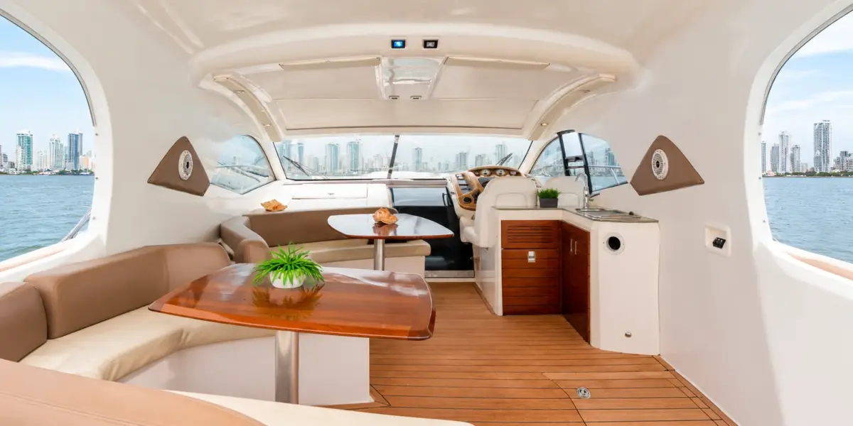 Cockpit lounge with dining table and helm on the Zetta yacht